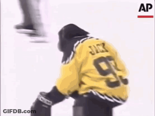Hockey Player In Yellow Jersey Number 99 GIF