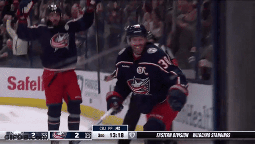 Hockey Player Jumping While Referee Looks On GIF