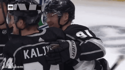 Hockey Player Kalij Hugging Another Player GIF