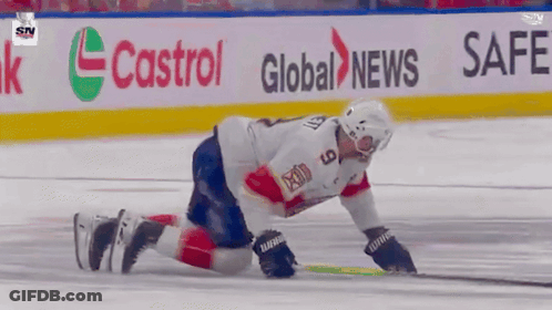 Hockey Player Kneeling On Ice In Front Of Safeway Banner GIF