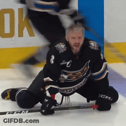 Hockey Player Kneeling On Ice With CCM Stick GIF
