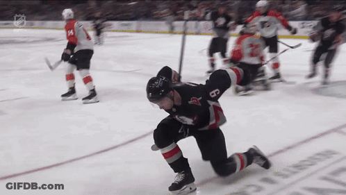 Hockey Player Kneeling On Ice With Number 8 GIF