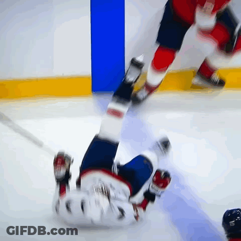 Hockey Player Laying On Ice With Number 5 GIF