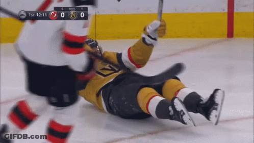 Hockey Player Lying On Ice GIF