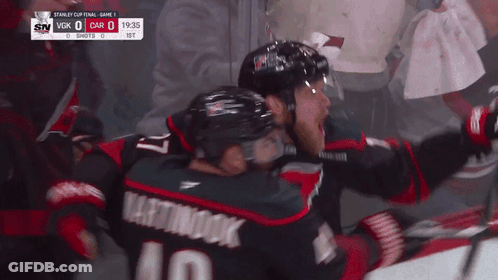 Hockey Player Number 10 Hugging Another Player GIF