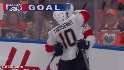 Hockey Player Number 10 Hugging Teammate GIF