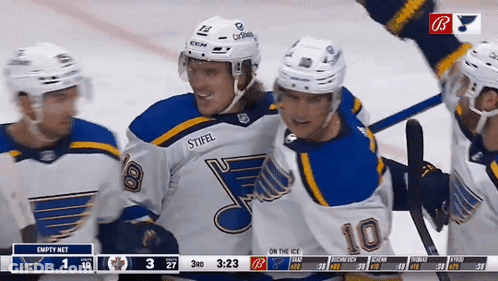Hockey Player Number 10 Surrounded By Teammates GIF