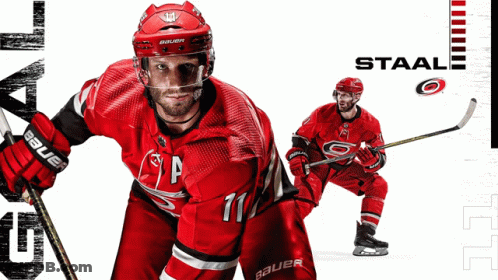 Hockey Player Number 11 Holding Hockey Stick GIF