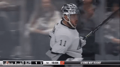 Hockey Player Number 11 Holding Stick GIF