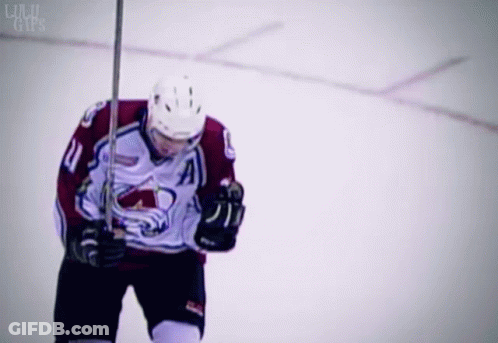 Hockey Player Number 11 Holding Stick GIF