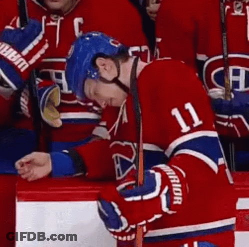 Hockey Player Number 11 Leaning On Bench GIF