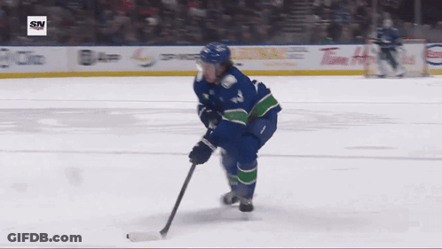 Hockey Player Number 12 Skating GIF