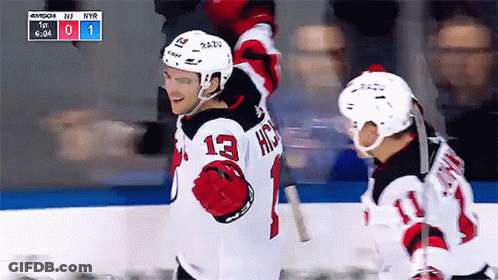 Hockey Player Number 13 Standing On Ice GIF