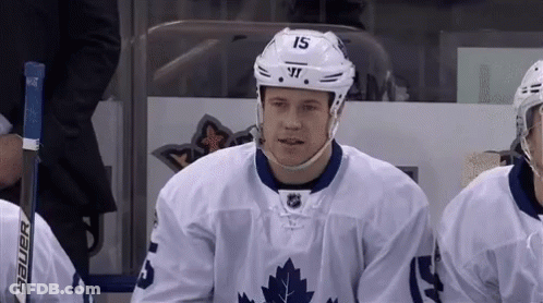 Hockey Player Number 15 Sitting On Bench GIF