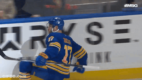 Hockey Player Number 17 Holding Stick GIF