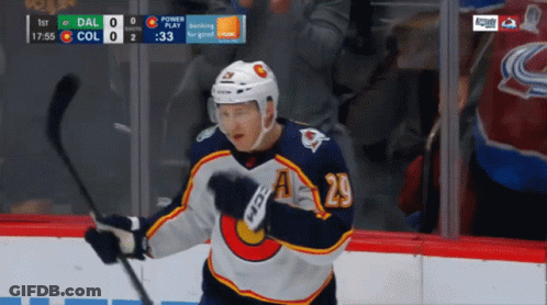 Hockey Player Number 20 Holding Stick GIF