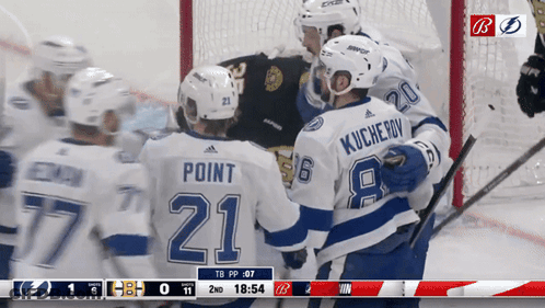 Hockey Player Number 21 Hugging Another Player GIF