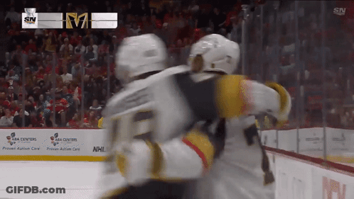 Hockey Player Number 21 In Front Of ESS UPR Sign GIF