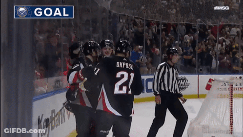 Hockey Player Number 21 Surrounded By Players GIF