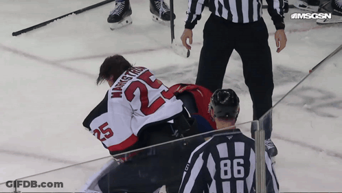Hockey Player Number 25 Laying On Ice GIF