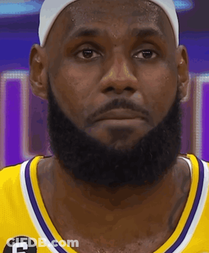 Hockey Player Number 25 Surrounded By Teammates GIF