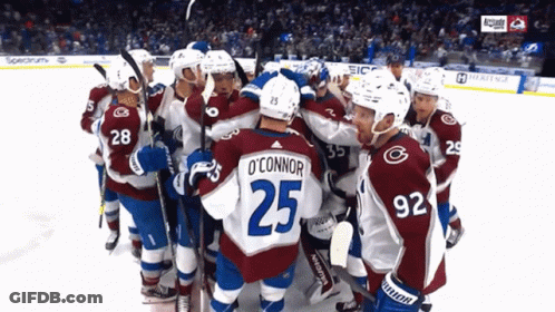 Hockey Player Number 25 Surrounded GIF