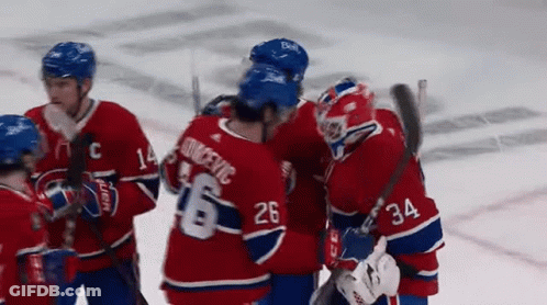 Hockey Player Number 26 Hugging Another Player GIF