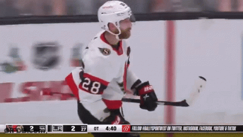 Hockey Player Number 28 Hugging Another Player GIF