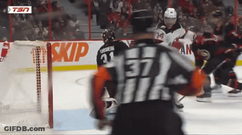 Hockey Player Number 37 In Front Of Skip Sign GIF