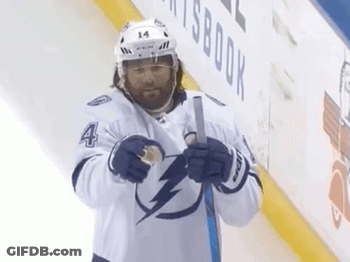 Hockey Player Number 4 Holding Stick GIF
