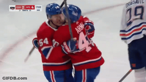 Hockey Player Number 44 Hugging Another Player GIF