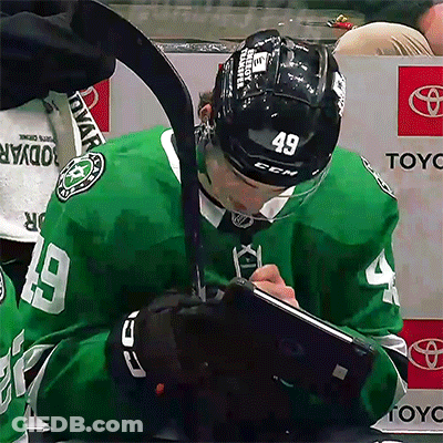 Hockey Player Number 49 Writing On Clipboard GIF