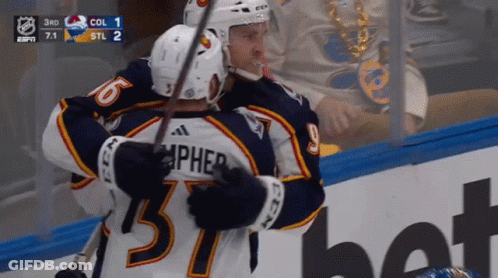 Hockey Player Number 57 Hugging Teammate GIF