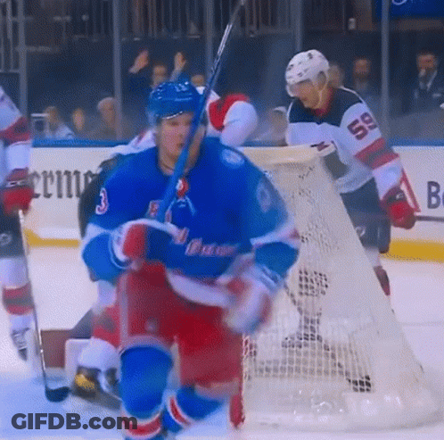 Hockey Player Number 59 Standing In Front Of Net GIF