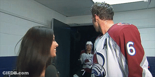 Hockey Player Number 6 Talking To Woman GIF