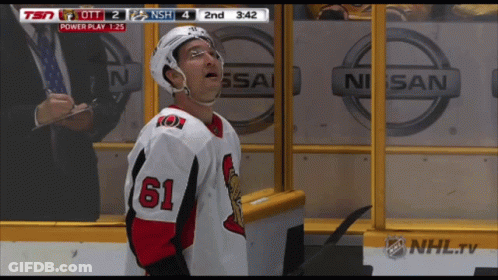 Hockey Player Number 61 In Front Of Nissan Logo GIF