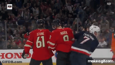 Hockey Player Number 61 Next To Referee GIF