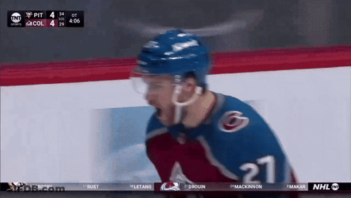 Hockey Player Number 62 Surrounded By Teammates GIF