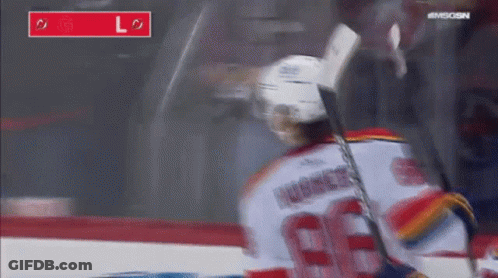 Hockey Player Number 66 Holding Stick GIF