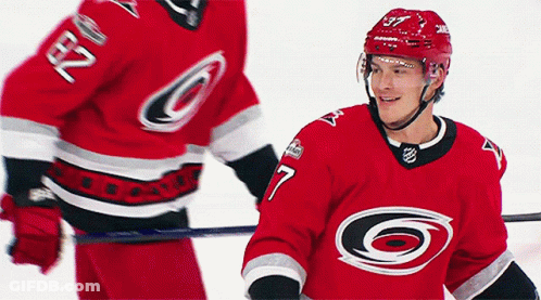 Hockey Player Number 7 Standing Next To Another GIF