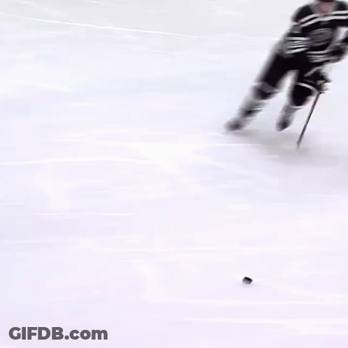 Hockey Player Number 72 Holding Puck GIF
