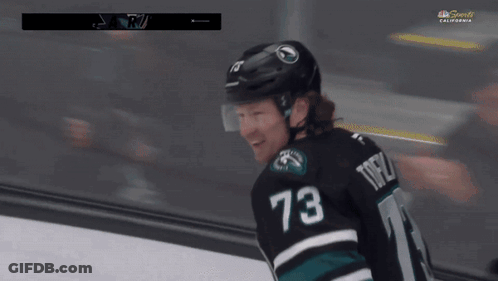 Hockey Player Number 73 Holding Stick GIF