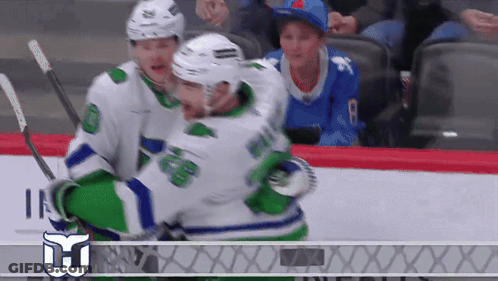 Hockey Player Number 8 Hugged By Another Player GIF