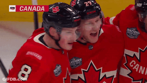Hockey Player Number 8 Hugging Another Player GIF