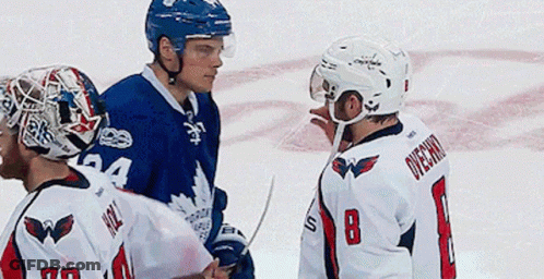 Hockey Player Number 8 Talks To Another Player GIF