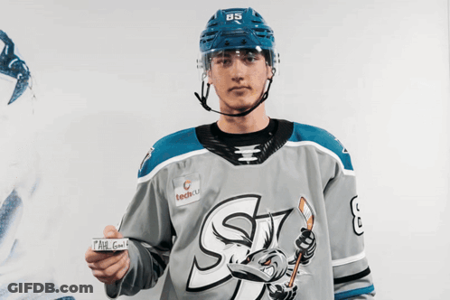 Hockey Player Number 85 Holding Paper GIF