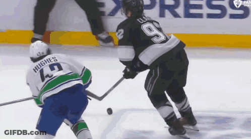 Hockey Player Number 9 Being Chased GIF