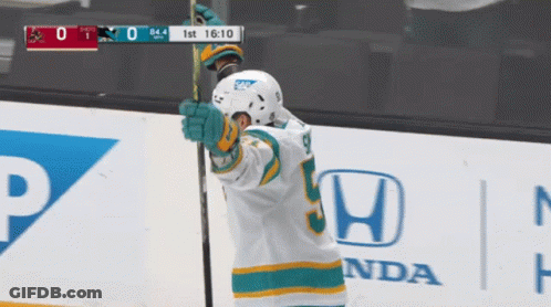Hockey Player Number 9 Holding Stick GIF