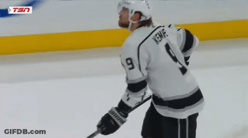 Hockey Player Number 9 Kneeling On Ice GIF
