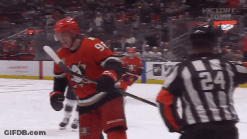 Hockey Player Number 9 Next To Referee 24 GIF
